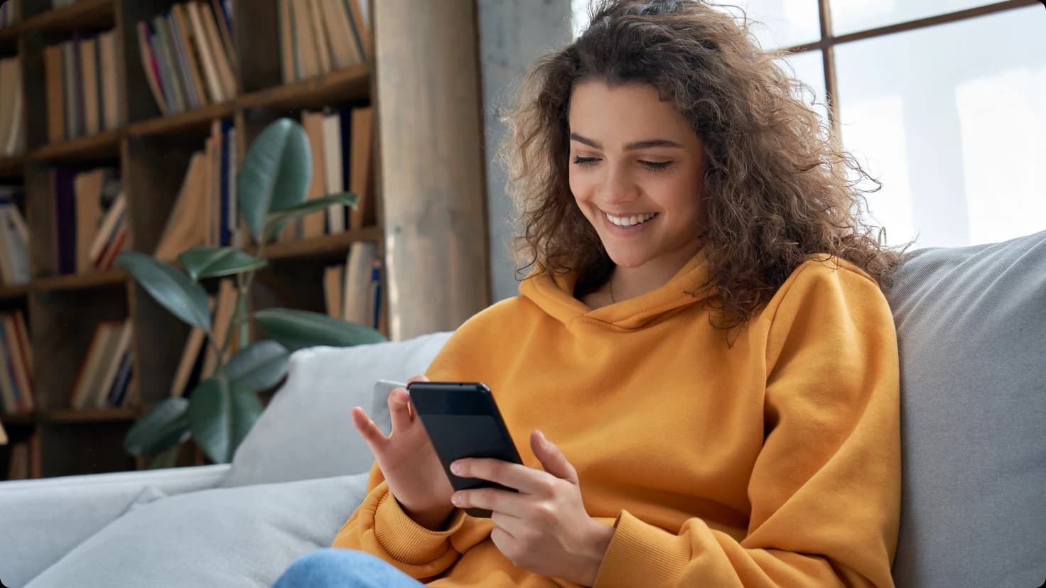 Woman With Phone In Hands