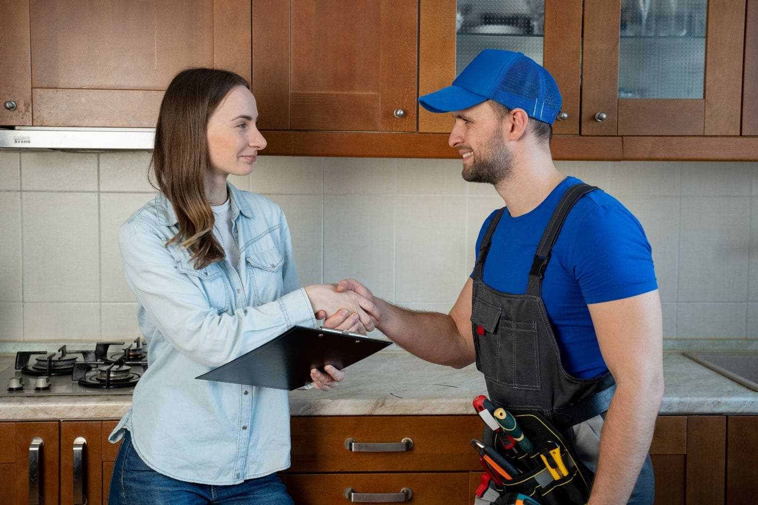 Plumber With A Satisfied Customer 