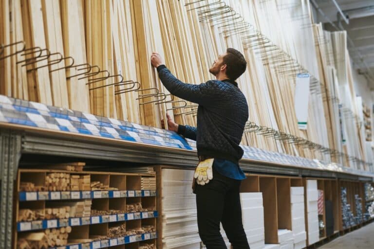 A worker catalogs wood at a factory