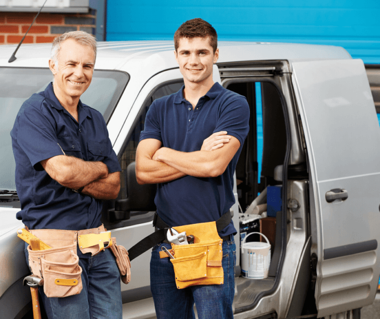 two technicians standing near the car